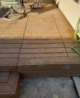 Deck with a hidden access drawer built into the boards